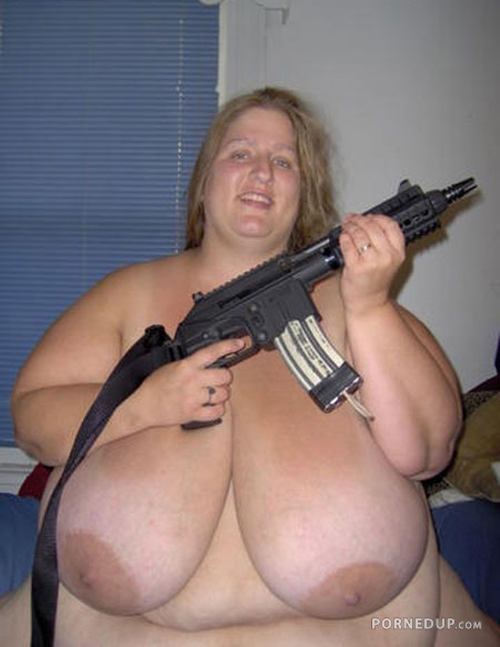 mega floppy big tits fatty holding gun