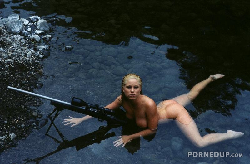 naked girl in water with huge gun