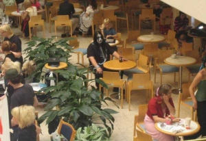fat goth is lonely in the mall food court