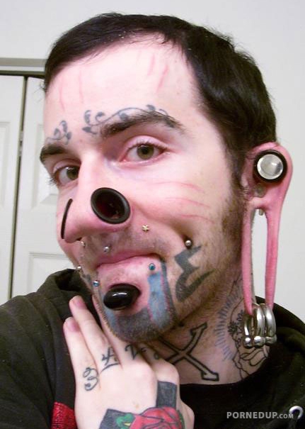 body modification loser shows off his stupid modifications