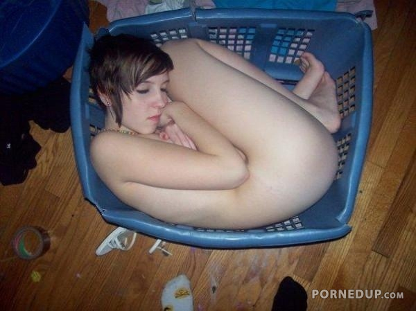 Little Girl Sleeping In Laundry Basket
