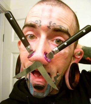 body mod guy with knives through his nose
