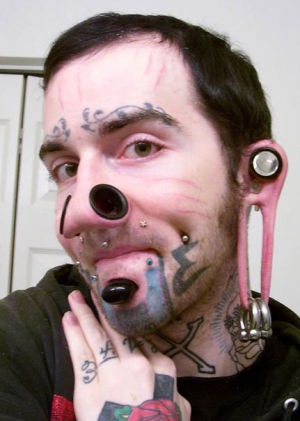 body modification loser shows off his stupid modifications