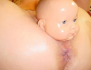 giving birth to plastic doll