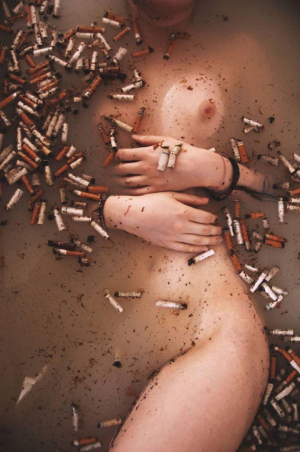 Hot Girl In A Bath Of Cigarettes