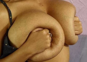 pressing her big tits together