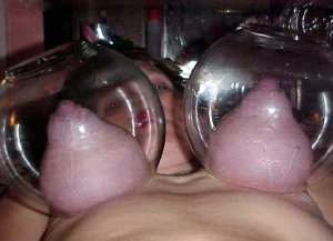 pumping up her boobs