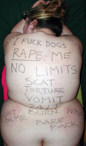 submissive slave with writing all over her back