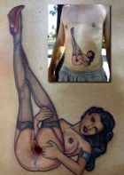 Gaping bellybutton tattoo