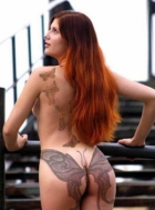 Girl with tattoo on her ass