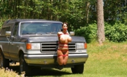 Huge fake tit slut tied to front of truck naked