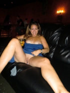 Showing her pussy at a bar