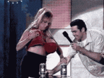 Smashing a beer can with her fake tits