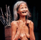 Toothless old granny shows off her saggy deflated tits