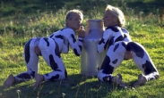 Two girls naked in cow makeup