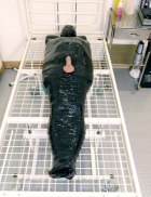 Wrapped in plastic with his cock sticking out